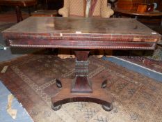 A WM.IV. ROSEWOOD FOLD OVER CARD TABLE ON SHAPED AND CARVED SQUARE SECTION COLUMN, PLATFORM BASE AND