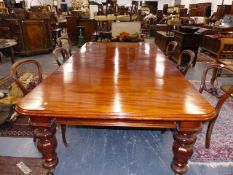 A GOOD EARLY VICTORIAN FLAME MAHOGANY EXTENDING DINING TABLE ON STOUT OCTAGONAL CARVED LEGS