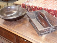 AN ANTIQUE TURNED TREEN DEEP BOWL. Dia.46cms. TOGETHER WITH A CARVED OAK CUTLERY TRAY.