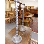 A PAIR OF ANTIQUE CARVED MAHOGANY SPIRAL TWIST CANDLESTICKS. H.58 cms.