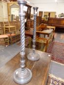 A PAIR OF ANTIQUE CARVED MAHOGANY SPIRAL TWIST CANDLESTICKS. H.58 cms.