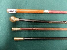 THREE MILITARY SWAGGER STICKS AND A ROYAL ARTILLERY RIDING CROP. (4)