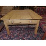 AN ANTIQUE AND LATER PINE LOW TABLE WITH TWO END DRAWERS. H.50 x W.106cms.