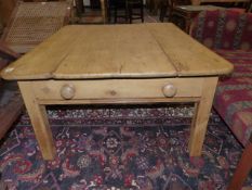 AN ANTIQUE AND LATER PINE LOW TABLE WITH TWO END DRAWERS. H.50 x W.106cms.