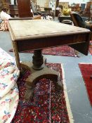 AN EARLY 19th.C.MAHOGANY DROP LEAF LIBRARY CENTRE TABLE ON CARVED COLUMN OVER PLATFORM AND TALL