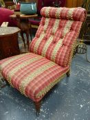A VICTORIAN BUTTON UPHOLSTERED NURSING CHAIR ON TURNED FORELEGS WITH CERAMIC CASTORS, LATER RED