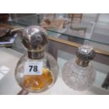 TWO SILVER MOUNTED SPHERICAL CLEAR GLASS SCENT BOTTLES, MARTIN & HALL, CHESTER 1909 AND A WORN