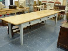 A COUNTRY PAINTED AND SCRUBBED PINE LONG FARMHOUSE KITCHEN TABLE WITH CLEATED TOP ABOVE FOUR APRON