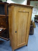 A CONTINENTAL WALNUT HALL CABINET WITH SINGLE PANEL DOOR ENCLOSING SHELVES. 78 x 42 x H.159cms.
