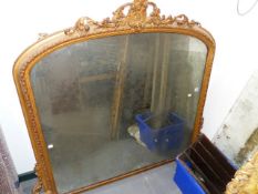 A VICTORIAN GILT FRAMED OVERMANTLE MIRROR WITH GESSO FOLIATE SCROLL DECORATION. W.138 x H.123cms.