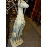 A PAIR OF COMPOSITE STONE GARDEN GATEPOST FIGURES OF SEATED DOGS. H.81cms.