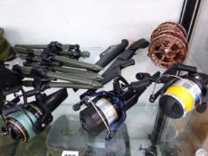 A WYCHWOOD SOLACE 10 FISHING REEL, A TIDEWATER 70 REEL, A BAITRUNNER DL6000 REEL AND TWO IKONIX