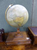A VINTAGE PHILLIPS 9" TERRESTRIAL GLOBE MOUNTED ON TURNED SUPPORT WITH A SHALLOW BASE DRAWER.