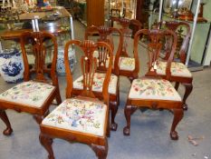 A SET OF SIX 18th.C FRUITWOOD DINING CHAIRS WITH SHAPED PIERCED SPLAT BACKS, DROP IN SEAT PADS AND