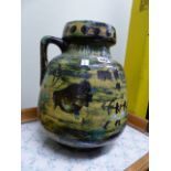 TWO CONTINENTAL POTTERY JUGS BOLD POLYCHROME DECORATION. LARGEST H.40cms. (2)