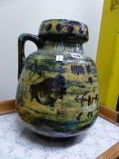 TWO CONTINENTAL POTTERY JUGS BOLD POLYCHROME DECORATION. LARGEST H.40cms. (2)