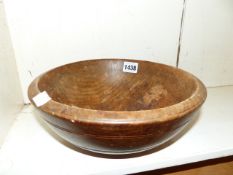 AN ANTIQUE TURNED WOOD FRUIT BOWL. Dia. 26cms.