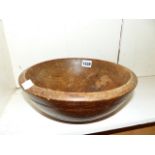 AN ANTIQUE TURNED WOOD FRUIT BOWL. Dia. 26cms.