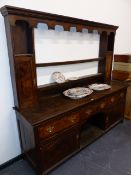 AN 18th.C.AND LATER OAK DRESSER WITH THREE DRAWERS OVER BURR PANELLED DOOR AND DOG KENNEL CENTRE,