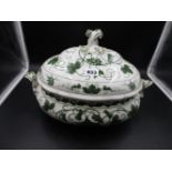 A MEISSEN TWO HANDLED SOUP TUREEN AND COVER DECORATED IN GREEN WITH VINES AND BACCHIC TROPHY