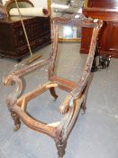 A WM.IV. CARVED ROSEWOOD SHOW FRAME ARMCHAIR ON BRASS CUP CASTORS.