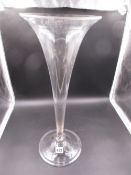 AN UNUSUAL TALL GLASS TRUMPET VASE WITH BUN KNOP ABOVE THE FOLDED RIM BASE. H.50cms.