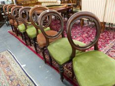 A SET OF FOUR VICTORIAN BALLOON BACK CHAIRS WITH GREEN OVERSTUFFED SEATS AND A FURTHER SET OF