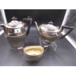 A SILVER PART TEA SET COMPRISING OF A HOT WATER POT, TEA POT AND TWO HANDLED SUGAR BOWL DATED 1920