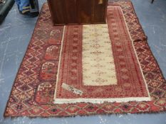 AN ANTIQUE ERSARI AFGHAN BOKHARA RUG. 200 x 164cms TOGETHER WITH AN ORIENTAL RUG OF TURKOMAN