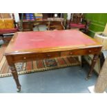 A VICTORIAN OAK LIBRARY TABLE WITH TWO FRIEZE DRAWERS ON TURNED LEGS WITH BRASS CASTORS, THE