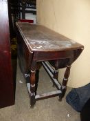 A LATE 18th.C.OAK DROP LEAF GATELEG COTTAGE SUPPER TABLE ON TURNED SUPPORTS. W.120 x H.72cms.