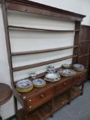 AN 18th.C.COUNTRY OAK POT BOARD DRESSER WITH THREE DRAWERS AND PLATE RACK OVER. W.177 x H.205cms.