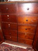 A 19th.C.COLONIAL TEAK CABINET WITH TWO PANEL DOOR ENCLOSING TEN GRADUATED SHORT DRAWERS STANDING ON