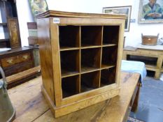 AN ANTIQUE CEDAR WOOD SMALL GLAZED CABINET WITH PIGEON HOLE FITTED INTERIOR.