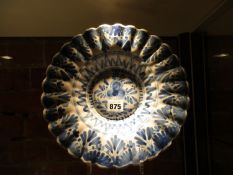 AN EARLY BLUE AND WHITE TIN GLAZED FLUTED BOWL, POSSIBLY FRANKFURT, PAINTED WITH FLOWERS AND