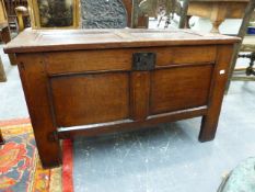 A GEORGIAN COUNTRY OAK COFFER WITH PANEL TOP AND CONFORMING FRONT ON STILE LEGS. 97 x 45 x H.58cms.