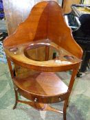 A REGENCY MAHOGANY CORNER WASHSTAND WITH BOWL RECESS TOP OVER PLATFORM WITH DRAWER AND PITCHER STAND