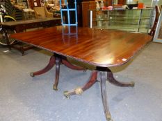 A 19th.C.MAHOGANY TWIN PEDESTAL DINING TABLE WITH TWO D-ENDS WITH URN SUPPORTS, REEDED SABRE LEGS