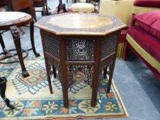 AN EASTERN HARDWOD OCTAGONAL TABLE WITH CARVED AND PIERCED DECORATION IN THE MOORISH MANNER. 60 x 60
