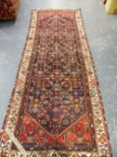 A PERSIAN HAMADAN RUNNER. 390 x 140cms.