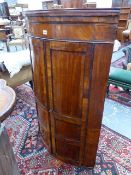 A LATE GEORGIAN MAHOGANY BOW FRONT TWO DOOR WALL HANGING CORNER CABINET. 80 x H.126cms.