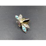 A VICTORIAN GEMSET INSECT BROOCH. THE BODY IS AN OVAL BANDED AGATE CABOCHON, WITH ONE PAIR OF OLD