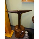 AN ANTIQUE IRON BOUND BLACKSMITH'S TALL ANVIL, STAKE LATER FITTED TO HEAVY STUMP WOOD BASE.