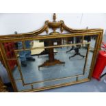 A REGENCY STYLE GILT FRAMED MARGINAL WALL MIRROR WITH URN AND SWAG CREST. 106 x 96cms.