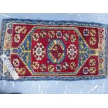 AN ANTIQUE TURKISH TRIBAL MAT. 100 x 54cms.