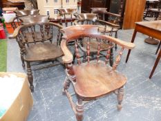 SIX ANTIQUE CAPTAIN'S CHAIRS WITH CURVED BACKS AND TURNED SPINDLE SUPPORTS.
