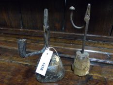 TWO EARLY WROUGHT IRON RUSH LIGHTS WITH WOODEN BASES. H.25cms.