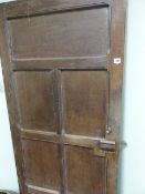 AN EARLY 20th.C.HAND MADE ARTS AND CRAFTS PANEL OAK DOOR COMPLETE WITH A WOODEN LATCH AND HASP IN