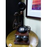 A VINTAGE CANDLESTICK TELEPHONE WITH WALL MOUNTED BELL BOX.