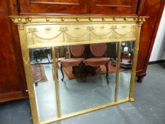 A REGENCY STYLE GILT FRAME OVERMANTLE MIRROR WITH TRIPLE BEVEL EDGE PLATE AND SWAG AND BALL